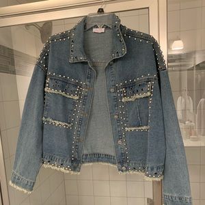 Studded jean jacket with distressing